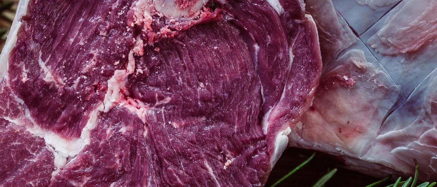 A marbled raw cut, the face a grader reads